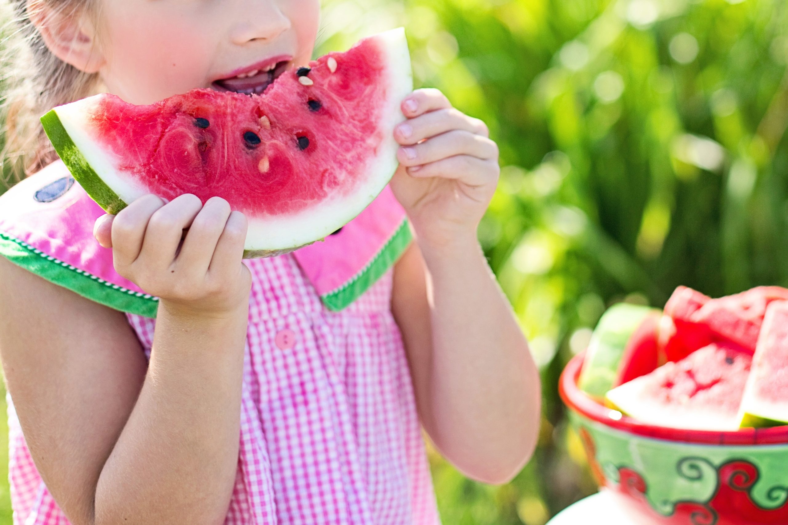 little girl eating watermelon - how to make your summer custody arrangement work